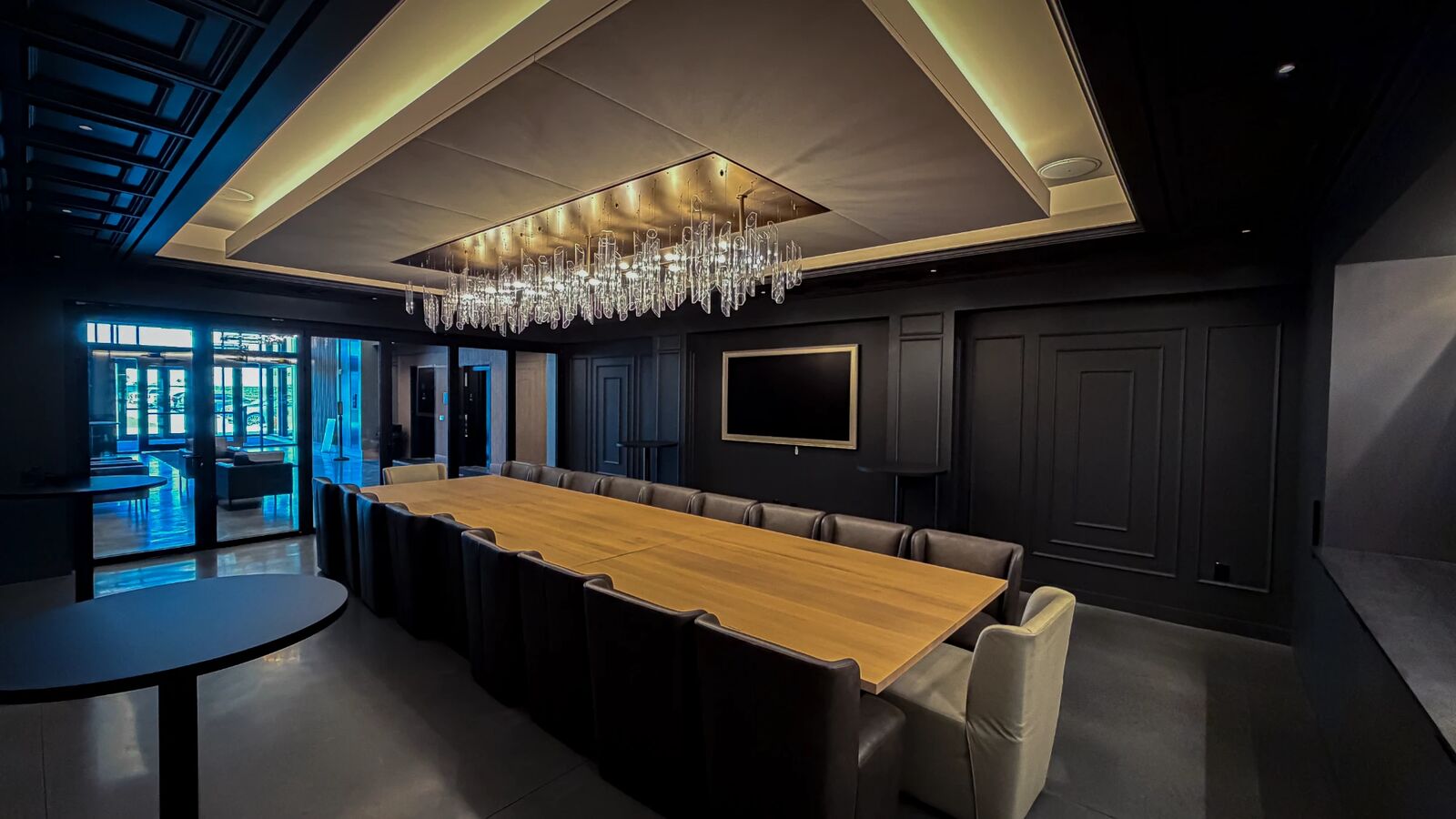 The long table and leather chairs, with glass doors to the lobby